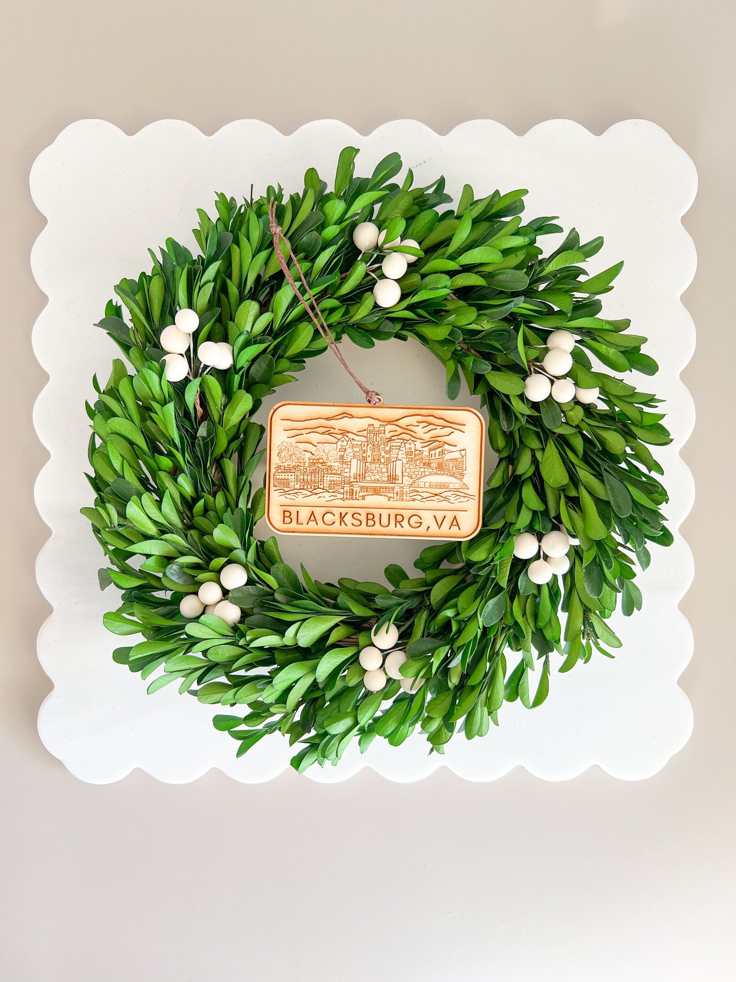 Wooden rectangular ornament with iconic Blacksburg, Virginia locations in a skyline. Featuring elements from Virginia Tech's campus. Go Hokies!