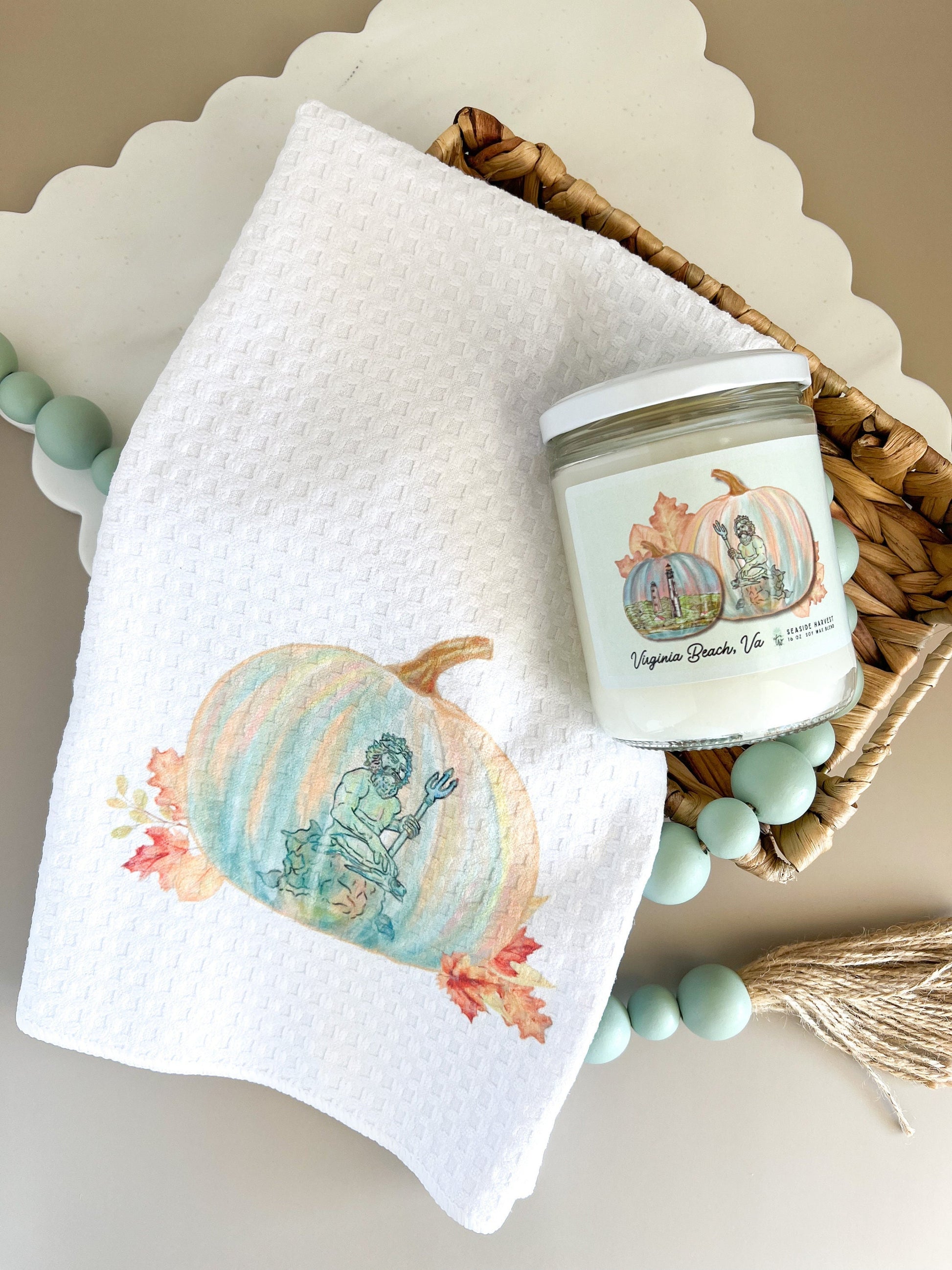 king Neptune statue design on a pumpkin.Printed on a tea towel and candle label.